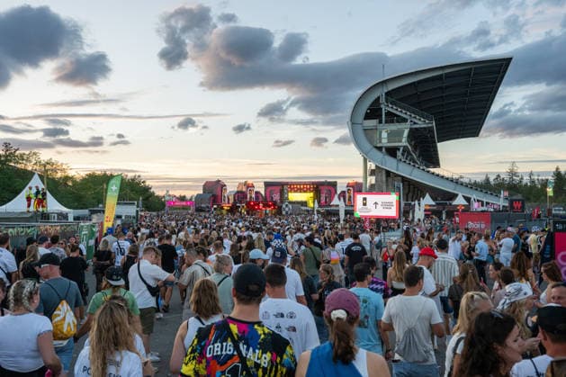 Numerous festivalgoers attend the Glücksgefühle Festival on the grounds of the Hockenheimring in Hockenheim, Baden-Württemberg, Germany