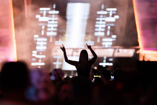 A festivalgoer at the Dimitri Vegas Like Mike performance at the Glücksgefühle Festival at the Hockenheimring in Hockenheim, Baden-Württemberg, Germany