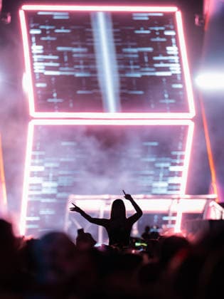 A festivalgoer at the Dimitri Vegas Like Mike performance at the Glücksgefühle Festival at the Hockenheimring in Hockenheim, Baden-Württemberg, Germany