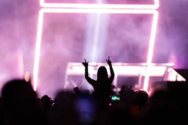 A festivalgoer at the Dimitri Vegas Like Mike performance at the Glücksgefühle Festival at the Hockenheimring in Hockenheim, Baden-Württemberg, Germany