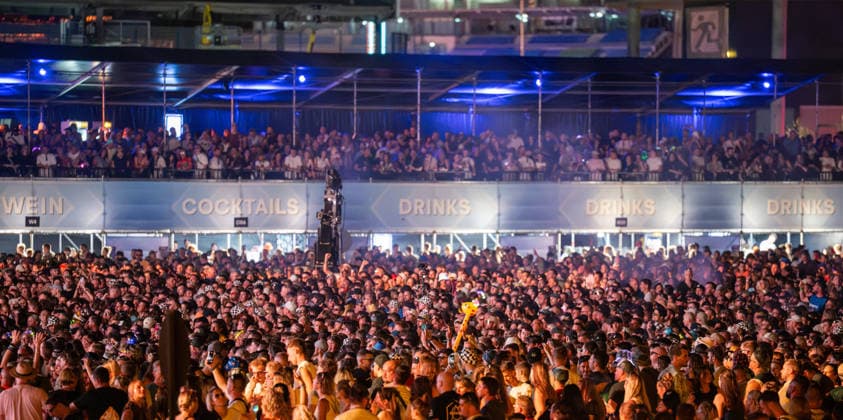 Overview of the large crowd of festivalgoers at the Dimitri Vegas & Like Mike performance at the Glücksgefühle Festival at the Hockenheimring in Hockenheim, Baden-Württemberg, Germany