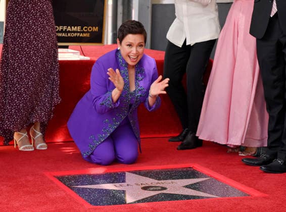 Filipina actress and singer Lea Salonga kneels next to her star during an unveiling ceremony honoring her with the 2,855th star on the Hollywood Walk of Fame in Los Angeles on Friday, September 4, 2026.  LAP2026090419 JIMxRUYMEN