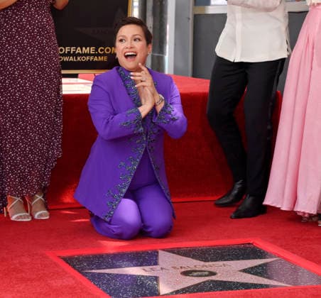 Filipina actress and singer Lea Salonga kneels next to her star during an unveiling ceremony honoring her with the 2,855th star on the Hollywood Walk of Fame in Los Angeles on Friday, September 4, 2026.  LAP2026090420 JIMxRUYMEN