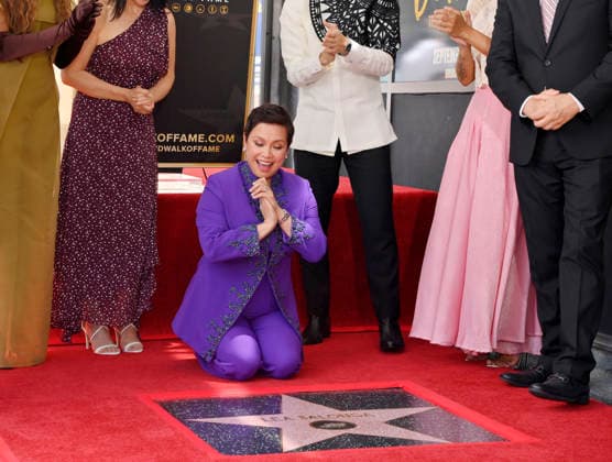Filipina actress and singer Lea Salonga kneels next to her star during an unveiling ceremony honoring her with the 2,855th star on the Hollywood Walk of Fame in Los Angeles on Friday, September 4, 2026.  LAP2026090421 JIMxRUYMEN