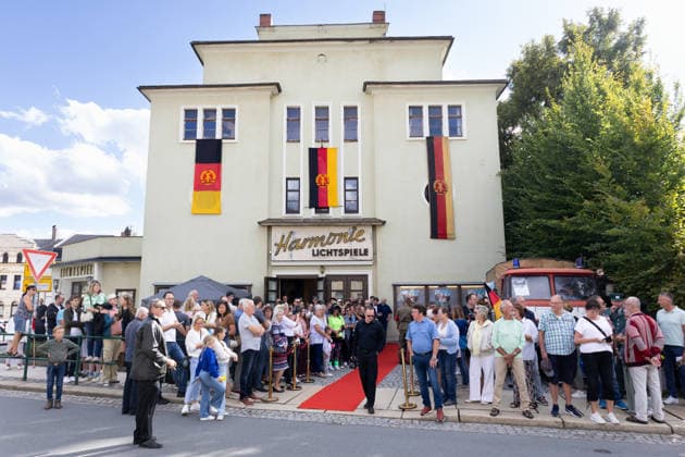 September 5, 2026, Movie Premiere, Comrade Wearing a Mask; View of the cinema lobby with GDR flags in the windows; Markneukirchen, Harmonie Lichtspiele, Saxony, Germany