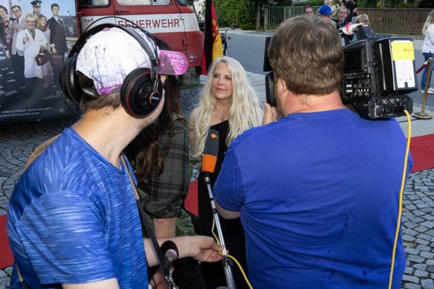 September 5, 2026, Film Premiere, *Maske auf Genossen*; Sandra Peter, Producer of *Maske auf Genossen*, in a TV interview; Markneukirchen Harmonie Lichtspiele, Saxony, Germany