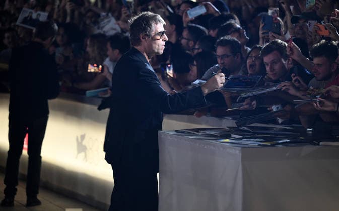 September 5, 2026, Venice, ITALY: Liam Gallagher of the English rock band Oasis signs autographs as he arrives for the premiere of Oasis: don™t look back in anger during the 83rd Venice Film Festival in Venice, Italy, 05 September 2026. The movie is presented out of competition at the festival running from 02 to 12 September 2026. ANSA ETTORE FERRARI. Venice ITALY  - ZUMAa110 20260905_zaf_a110_139 Copyright: xEttorexFerrarix