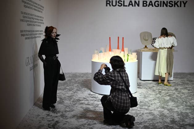 A woman poses at the stand of the Ukrainian headwear brand Ruslan Baginskiy, presenting the debut unisex perfume Grain de Sel, during Ukrainian Fashion Week SS27 at the Mystetskyi Arsenal National Cultural, Art and Museum Complex, Kyiv, Ukraine, September 5, 2026. (Photo by Yevhen Kotenko Ukrinform) Guests visit Ukrainian Fashion Week SS27 in Kyiv  Copyright: xYevhenxKotenkox
