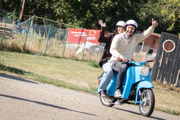 AfD lead candidate Ulrich Siegmund casts his vote on Election Day at the special education school in Tangermünde; he and his wife Julia arrive at the polling place on a Simson Schwalbe moped. AfD lead candidate Ulrich Siegmund casts his vote in Tangermünde, Tangermünde, Saxony-Anhalt, Germany; Tangermünde Special Education School