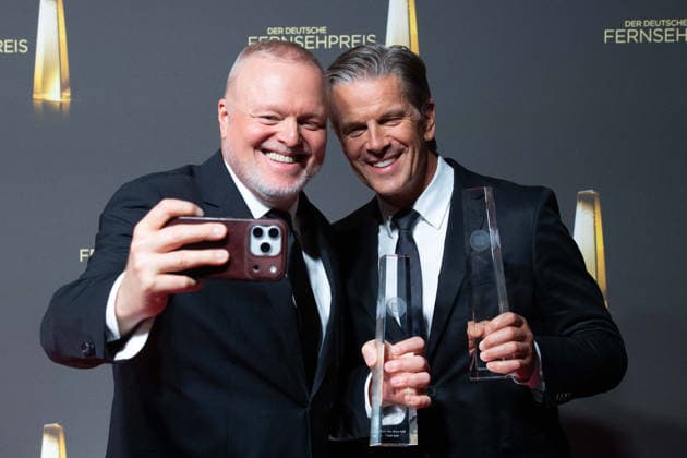 Award winners Stefan RAAB and Markus LANZ (from left) take a selfie with a smartphone at the German Television Award ceremony, the 2026 German Television Award, held at Confex Cologne on September 9, 2025