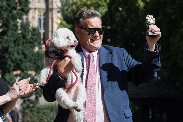 September 10, 2026, London, England, United Kingdom: Karl Turner MP and bichon frise Charlie, the winners of the 3rd place in the Westminster Dog of the Year competition pose in the Victoria Tower Gardens. The event is a celebration of the unique bond between dogs and their owners, and gives parliamentarians the opportunity to highlight the important work that they ve undertaken in Parliament on dog related matters, whilst promoting responsible dog ownership. London United Kingdom  - ZUMAs371 20260910_zip_s371_012 Copyright: xWiktorxSzymanowiczx