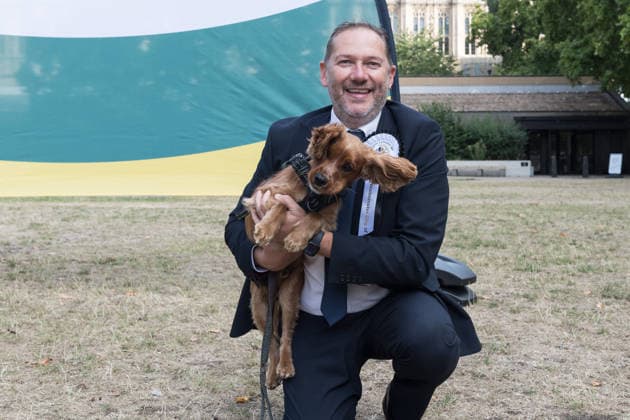 September 10, 2026, London, England, United Kingdom: Douglas Lumsden MP and his canine companion cockalier Norman take part in the Westminster Dog of the Year competition in the Victoria Tower Gardens. The event is a celebration of the unique bond between dogs and their owners, and gives parliamentarians the opportunity to highlight the important work that they ve undertaken in Parliament on dog related matters, whilst promoting responsible dog ownership. London United Kingdom  - ZUMAs371 20260910_zip_s371_024 Copyright: xWiktorxSzymanowiczx
