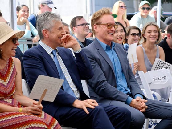 American screenwriter, television producer and director Greg Daniels (C) and his wife Susanne Daniels (L), and Conan O Brien react to comments during an unveiling ceremony honoring Daniels with the 2,856th star on the Hollywood Walk of Fame in Los Angeles on Thursday, September 10, 2026.  LAP2026091029 JIMxRUYMEN