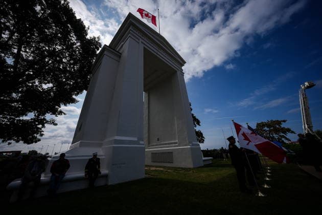 September 11, 2026, Surrey, Bc, CANADA: Flag bearers are silhouetted during the Northwest 9 11 Memorial ceremony at the Peach Arch monument on the Canada-U.S. border between Surrey, B.C., and Blaine, Wash., in Surrey, B.C., on Friday, Sept. 11, 2026. Surrey CANADA - ZUMAc35_ 20260911_zaf_c35_143 Copyright: xDarrylxDyckx