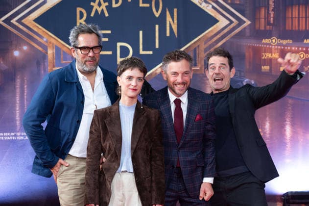 From left: Achim von BORRIES, director; Liv Lisa FRIES, actress; Volker BRUCH, actor; Tom TYKWER, director; Red Carpet, Red Carpet Show, Arrival, Premiere of the final season of Babylon Berlin on September 11, 2026, at the Naturstrom Open-Air Cinema at Rheinau Harbor in Cologne,
