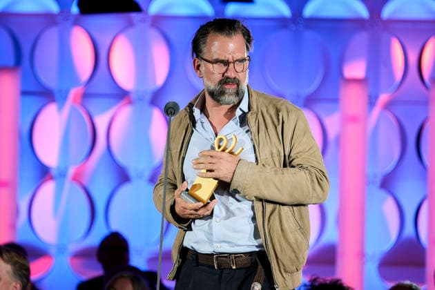 2026 German Acting Award: Rick Ostermann accepting the award on behalf of winner Armin Rohde; Stage show celebrating 15 years of the German Acting Award and 20 years of the BFFS; Pullman Berlin Schweizerhof; Date: September 11, 2026 Copyright: xEventpressx