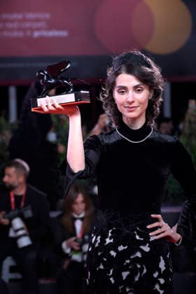 Laleh Marzban poses with the Orizzonti Best Actress Award for Moragheb (Falling House) at the Winners Photocall during the 83rd Venice International Film Festival at Sala Grande on September 12, 2026 in Venice, Italy.  VEN20260912803 RoccoxSpaziani
