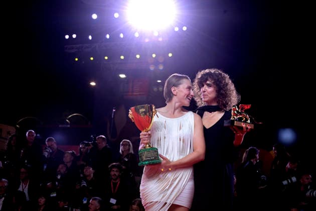 Mathilde Arcel and May el-Toukhy pose with the Coppa Volpi for Best Actress Award and with the Golden Lion for the Best Film Award for Woman Unknown at the Winners Photocall during the 83rd Venice International Film Festival at Sala Grande on September 12, 2026 in Venice, Italy.  VEN20260912813 RoccoxSpaziani