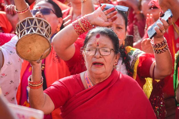 September 14, 2026, Kathmandu, Bagmati, Nepal: Hindu women devotees gather to celebrate the Teej festival at Pashupatinath Temple in Kathmandu, Nepal, on September 14, 2026. Teej, also known as Hartalika Teej, is a major Hindu festival dedicated to Lord Shiva and Goddess Parvati. Women visit the temple from early morning to offer prayers, flowers and puja materials, perform religious rituals and seek blessings. Married women traditionally observe a day-long fast for the health, longevity and well-being of their husbands and the prosperity of their families, while unmarried women may fast and pray for a suitable life partner. Devotees dressed in traditional red saris and festive attire form long queues for darshan and take part in devotional - ZUMAs330 20260914_zsp_s330_036 Copyright: xSafalxPrakashxShresthax