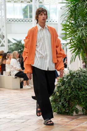 Models present creations from Adolfo Dominguez s Croma collection for spring-summer 2027 during Mercedes-Benz Fashion Week Madrid. Under the creative direction of Tiziana Domínguez, the Galician label, marking its 50th anniversary, remained faithful to its signature codes, showing pronounced asymmetry, scarves worked into both menswear and womenswear, sequins and textile appliques, alongside organic cotton denim dyed in tangerine tones and mini-pleated men s trousers. September 14,2026. (20260914902)