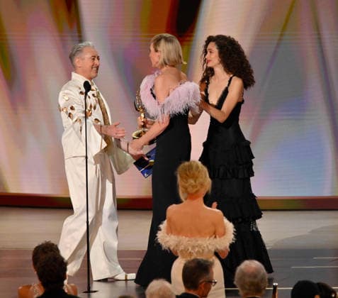 Allison Janney accepts the Outstanding Supporting Actress in a Drama Series Award for The Diplomat from Alan Cumming and Emmy Rossum on stage during the 78th annual Primetime Emmy Awards at the Peacock Theater in Los Angeles on Monday, September 14, 2026.  LAP2026091465 JIMxRUYMEN