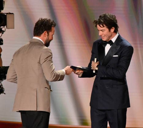 Noah Wyle accepts the Outstanding Lead Actor in a Drama Series Award for The Pitt from John Mulaney on stage during the 78th annual Primetime Emmy Awards at the Peacock Theater in Los Angeles on Monday, September 14, 2026.  LAP2026091478 JIMxRUYMEN