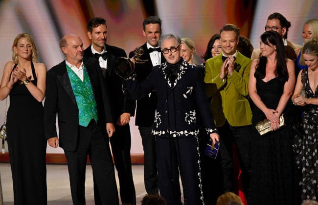 Cast and crew including Stephen Lambert, Mike Cotton, Sam Rees-Jones, Rosie Franks and Alan Cumming accept the Outstanding Reality Competition Program Award for The Traitors on stage during the 78th annual Primetime Emmy Awards at the Peacock Theater in Los Angeles on Monday, September 14, 2026.  LAP2026091495 JIMxRUYMEN