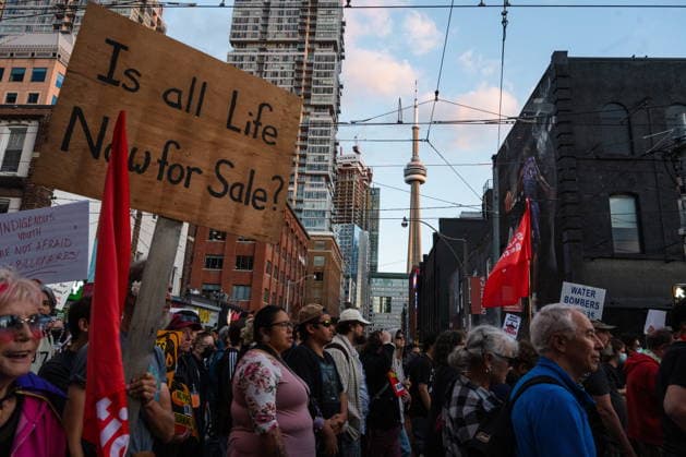 September 14, 2026, Toronto, On, CANADA: Protesters demonstrate against the Canada Investment Summit that Prime Minister Mark Carney is hosting in Toronto, on Monday, Sept. 14, 2026. Toronto CANADA  - ZUMAc35_ 20260914_zaf_c35_132 Copyright: xLauraxProctorx