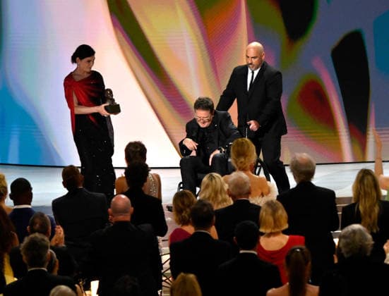 Julianna Margulies presents Michael J. Fox with the Bob Hope Humanitarian Award on stage during the 78th annual Primetime Emmy Awards at the Peacock Theater in Los Angeles on Monday, September 14, 2026.  LAP20260914134 JIMxRUYMEN