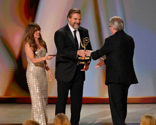 Vince Gilligan accepts the Outstanding Writing for a Drama Series Award for Pluribus from Linda Cardellini and David Harbour on stage during the 78th annual Primetime Emmy Awards at the Peacock Theater in Los Angeles on Monday, September 14, 2026.  LAP20260914162 JIMxRUYMEN