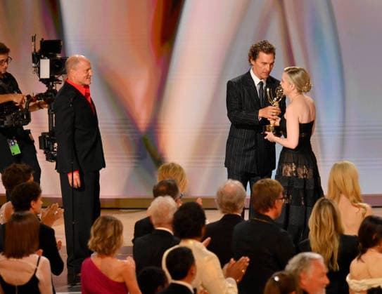 Katie Dippold accepts the Outstanding Comedy Series Award for Widow s Bay from Woody Harrelson and Matthew McConaughey on stage during the 78th annual Primetime Emmy Awards at the Peacock Theater in Los Angeles on Monday, September 14, 2026.  LAP20260914203 JIMxRUYMEN