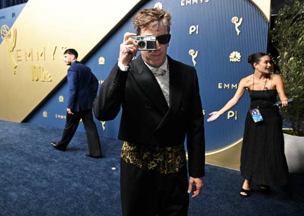 Adam Bricker turns his camera on the photographers arrives for the 78th annual Primetime Emmy Awards at the Peacock Theater in Los Angeles on Monday, September 14, 2026.  LAP20260914890 JohnxMcCoy