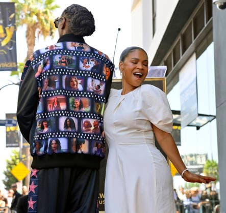 Actress Nia Long is joined by American rapper and actor Snoop Dogg during an unveiling ceremony honoring her with the 2,857th star on the Hollywood Walk of Fame in Los Angeles on Wednesday, September 16, 2026. Snoop Dogg s jacket displays stills from the many films Long has performed in.  LAP2026091614 JIMxRUYMEN