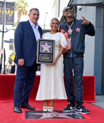 Actress Nia Long is joined by British film producer Graham King (L) and American rapper and actor Snoop Dogg during an unveiling ceremony honoring her with the 2,857th star on the Hollywood Walk of Fame in Los Angeles on Wednesday, September 16, 2026.  LAP2026091616 JIMxRUYMEN