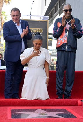 Actress Nia Long reacts during an unveiling ceremony honoring her with the 2,857th star on the Hollywood Walk of Fame in Los Angeles on Wednesday, September 16, 2026. Looking is British film producer Graham King (L) and American rapper and actor Snoop Dogg.  LAP2026091618 JIMxRUYMEN