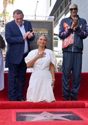 Actress Nia Long reacts during an unveiling ceremony honoring her with the 2,857th star on the Hollywood Walk of Fame in Los Angeles on Wednesday, September 16, 2026. Looking is British film producer Graham King (L) and American rapper and actor Snoop Dogg.  LAP2026091619 JIMxRUYMEN