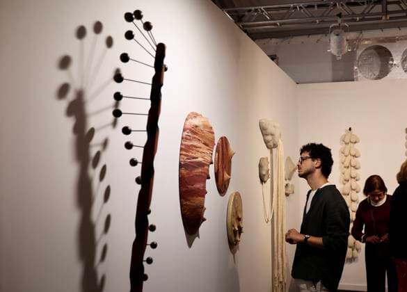 (260917) -- RIO DE JANEIRO, Sept. 17, 2026 -- A visitor looks at an art installation during the ArtRio 2026 in Rio de Janeiro, Brazil, Sept. 16, 2026. The five-day fair kicked off here on Wednesday, showcasing contemporary artworks such as paintings, sculptures and art installations from around the world. ) BRAZIL-RIO DE JANEIRO-ART FAIR-OPENING JinxHaoyuan 