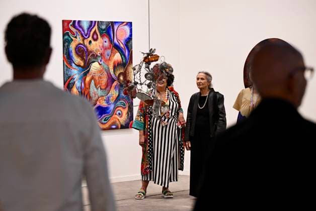 (260917) -- RIO DE JANEIRO, Sept. 17, 2026 -- Visitors look at an art installation during the ArtRio 2026 in Rio de Janeiro, Brazil, Sept. 16, 2026. The five-day fair kicked off here on Wednesday, showcasing contemporary artworks such as paintings, sculptures and art installations from around the world. ) BRAZIL-RIO DE JANEIRO-ART FAIR-OPENING JinxHaoyuan 