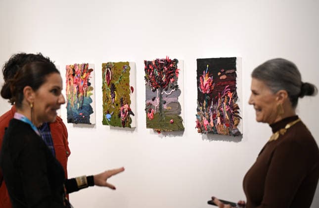 (260917) -- RIO DE JANEIRO, Sept. 17, 2026 -- Visitors communicate during the ArtRio 2026 in Rio de Janeiro, Brazil, Sept. 16, 2026. The five-day fair kicked off here on Wednesday, showcasing contemporary artworks such as paintings, sculptures and art installations from around the world. ) BRAZIL-RIO DE JANEIRO-ART FAIR-OPENING JinxHaoyuan 