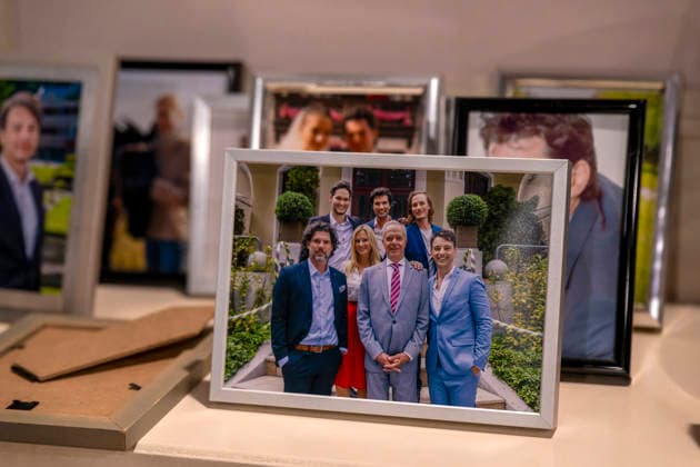 September 16, 2026, ARD telenovela *STURM DER LIEBE*, Photo shoot for Season 23 on the film set in Munich, at Bavaria Film in Geiselgasteig, in the studio set of the fictional Hotel Fürstenhof; actor Dirk Galuba as Senior Manager Saalfeld in a portrait photo by the fireplace with the cast 16 09 2026, ARD series *Sturm der Liebe* September 16, 2026, ARD series *Sturm der Liebe*