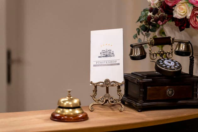 September 16, 2026, ARD telenovela *STURM DER LIEBE*, photo shoot for Season 23 on the film set in Munich, at Bavaria Film in Geiselgasteig, in the studio set of the fictional Hotel Fürstenhof reception area with a telephone and doorbell, September 16, 2026, ARD series *Sturm der Liebe* September 16, 2026, ARD series *Sturm der Liebe*