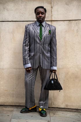 London Fashion Week in London - 17 Sep 2026 An attendee arrives wearing silver and black silk suit at the Francesca Lake Womenswear and Menswear presentation, held at NEWGEN, 180 Strand, London, as part of London Fashion Week 2026. Models and members of the fashion industry arrive at NEWGEN, 180 Strand, London, for the Francesca Lake Womenswear and Menswear presentation during the London Fashion Week 2026. The presentation showcases the latest collections by British designer Francesca Lake as part of the official London Fashion Week schedule, bringing together models, fashion professionals, media and industry guests at the central London venue. London United Kingdom Copyright: xJamesxWilloughbyx xSOPAxImagesx JWILLOUGHBY_3413