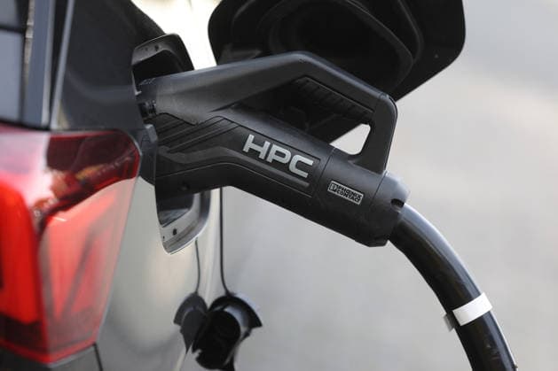 An electric vehicle is being charged at the Siegerland West rest stop. The charging cable is plugged into the car. Electric mobility on September 19, 2026, in Siegen, Germany