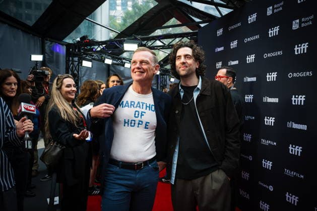 September 19, 2026, Toronto, On, Canada: Darrell Fox, brother of Terry Fox, left, and director Sean Menard are pictured on the red carpet for Run Terry Run at the Toronto International Film Festival in Toronto, on Saturday, Sept. 19, 2026. Toronto Canada - ZUMAc35_ 20260919_zaf_c35_118 Copyright: xLauraxProctorx