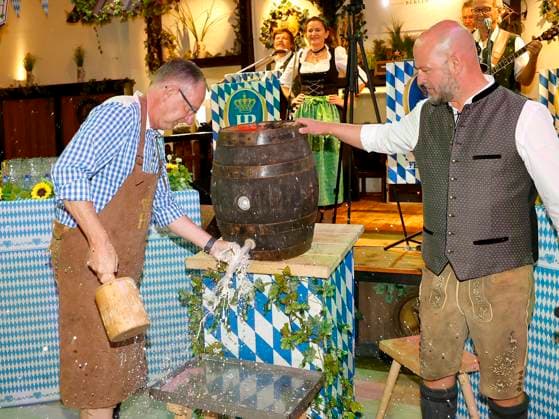 Bernd Siggelkow and Björn Schwarz at the keg tapping ceremony during the Oktoberfest Mittagsanstich at the Hofbräuhaus Berlin with Pastor Bernd Siggelhow