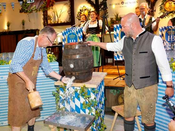 Bernd Siggelkow and Björn Schwarz at the keg tapping ceremony during the Oktoberfest Mittagsanstich at the Hofbräuhaus Berlin with Pastor Bernd Siggelhow