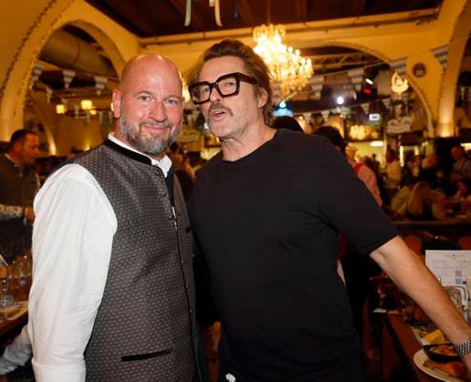 Björn Schwarz and Bruno Eyron O™ tap the second keg at the keg-tapping ceremony with Frank Zander at the Oktoberfest at the Hofbräuhaus Berlin