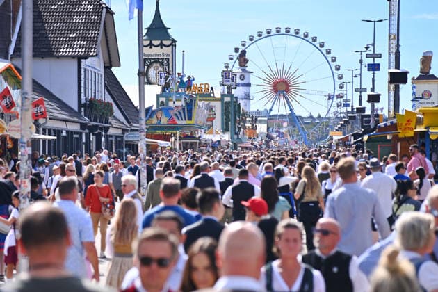 Ferris wheel, crowds of visitors, throngs of people, large crowds on September 20, 2026, at the 191st Oktoberfest, held from September 19 to October 4, 2026, at the Theresienwiese in Munich