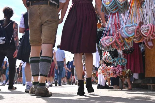 Visitors in traditional dress, lederhosen, dirndls, giant Ferris wheel, crowds of visitors, rush of people,crowds on September 20, 2026, at the 191st Oktoberfest, held from September 19 to October 4, 2026, at the Theresienwiese in Munich