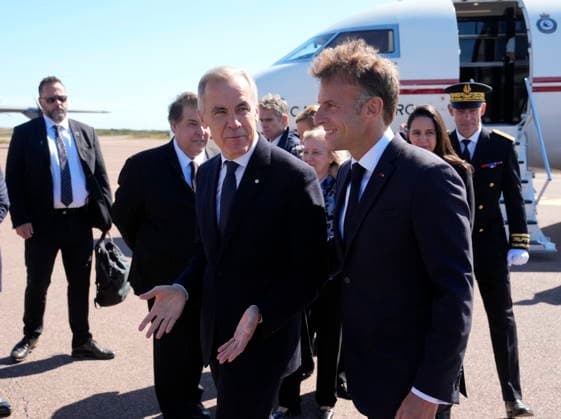 September 20, 2026, Saint-Pierre, France: French President Emmanuel Macron, right, greets ..Prime Minister Mark Carney as he arrives in Saint-Pierre, Saint-Pierre-et-Miquelon, a French territory 20 kilometres off the southern coast of Newfoundland, on Sunday, Sept. 20, 2026. Saint-Pierre France - ZUMAc35_ 20260920_zaf_c35_005 Copyright: xAdrianxWyldx